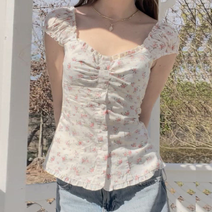 Damebluse med blomsterdesign og volangdetaljer Skjora