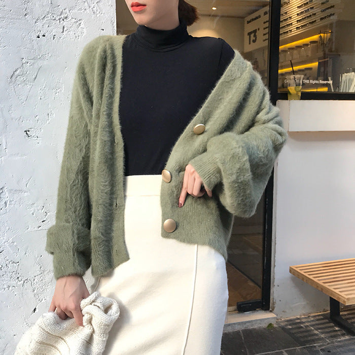 Kvinnens koselige cardigan med store knapper og oversized passform Skjora