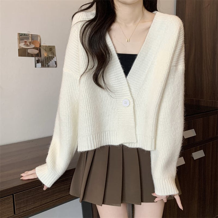 Kvinnenes løse cardigan med V-hals og store knapper Skjora