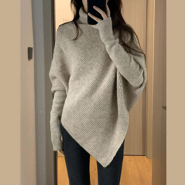 Kvinnes oversized strikket genser med asymmetrisk kutt og fin ribbestruktur Skjora