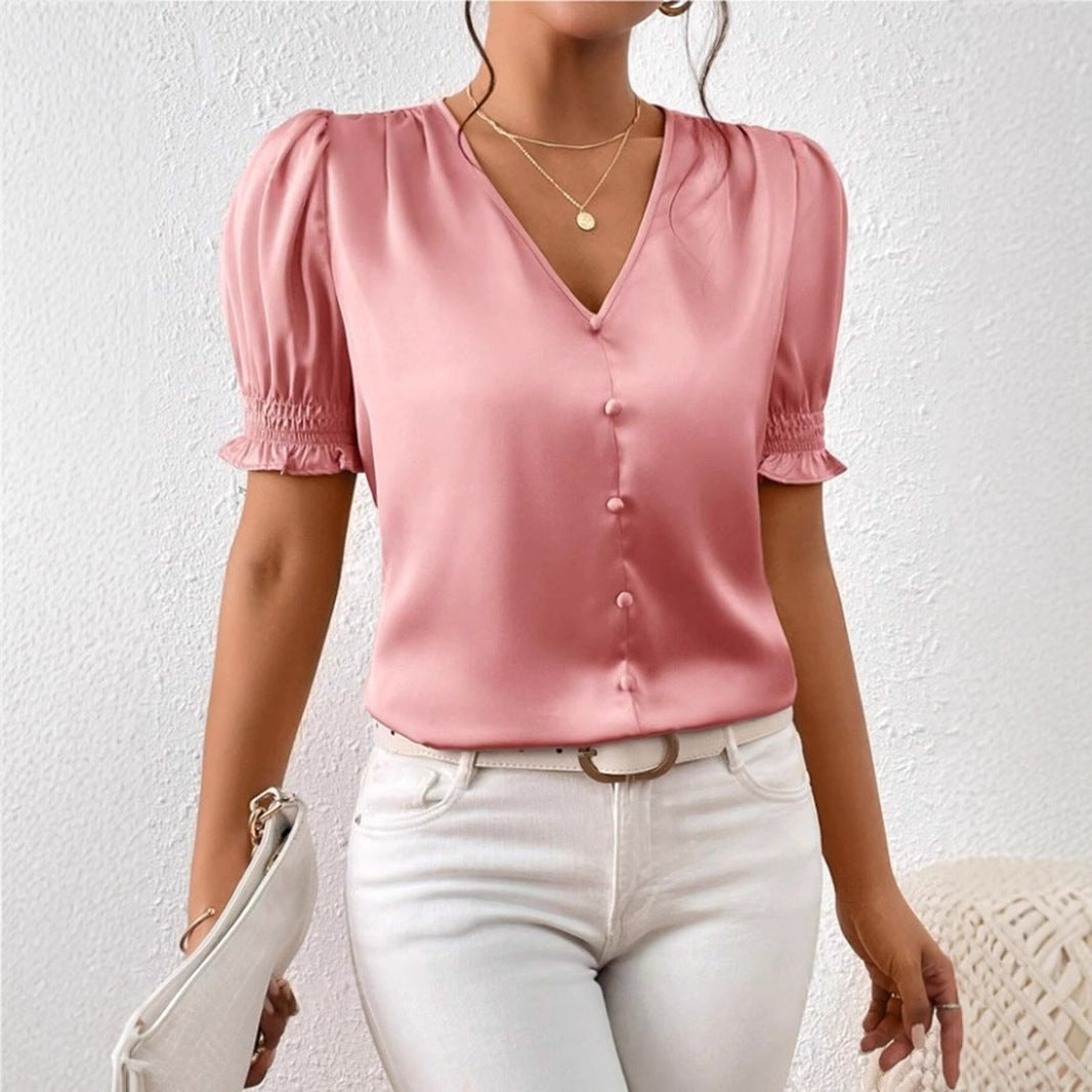 Dame satengbluse med pufferm og elegant knappeliste Skjora