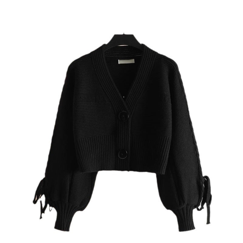 Dames fashionabel cropped cardigan med elegante knappdetaljer og unik ribbestruktur Skjora