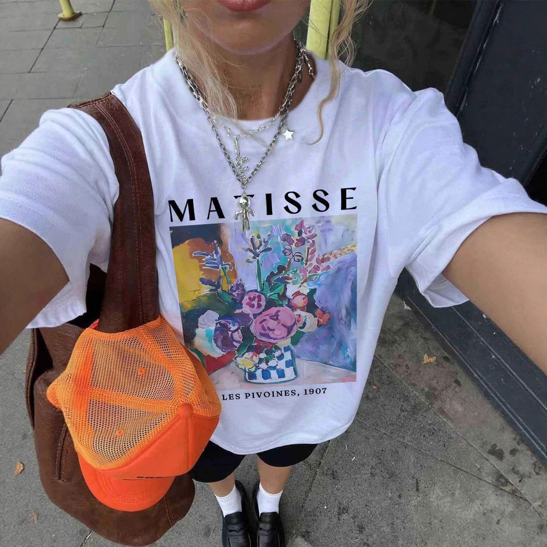 Dame T-skjorte med kunstnerisk grafisk trykk og avslappet snitt Skjora