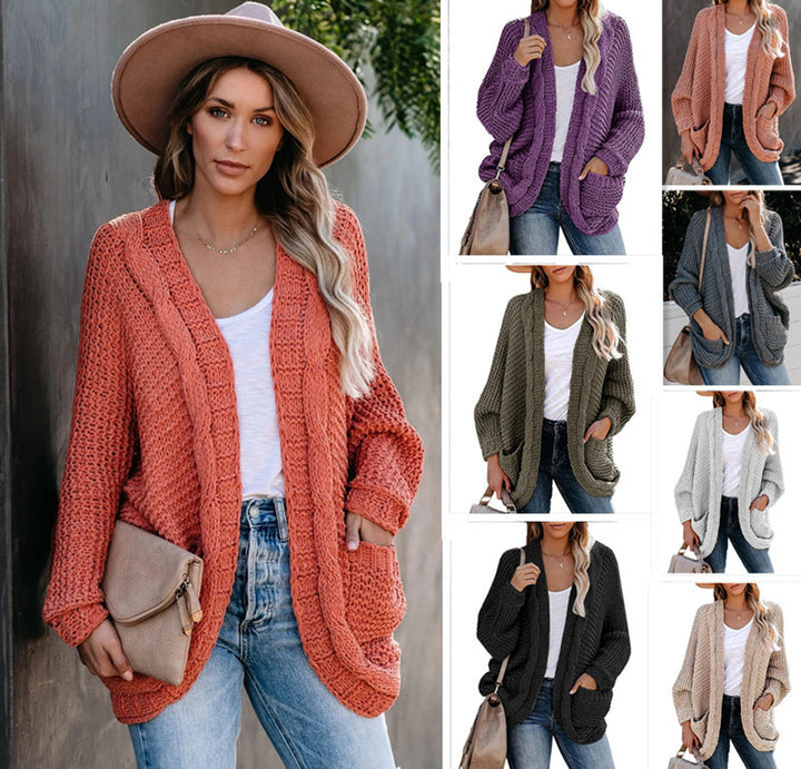 Kvinnes chunky strikk cardigan med uformelle lommer og voluminøse ermer Skjora