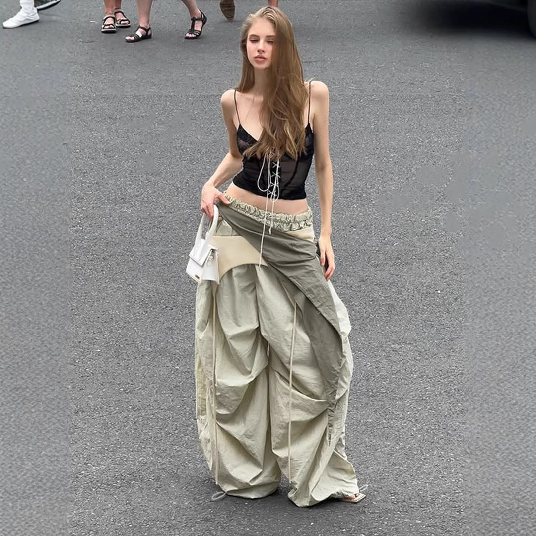 Dame modische High-Waist-bukse med asymmetrisk design og sidelivsnedbinding Skjora