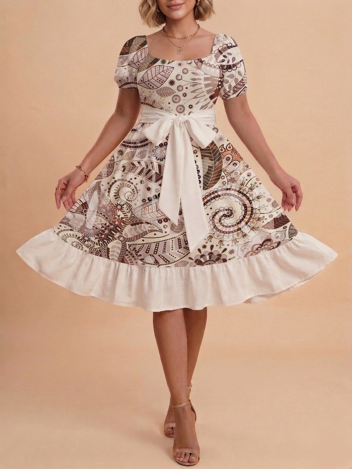 Damen modernes Blumenkleid mit elegantem Taillengürtel und asymmetrischem Saum Skjora