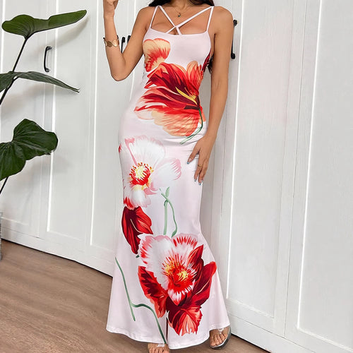 Dame Maxikjole med elegant blomsterdesign og delikate spagettistropper Skjora
