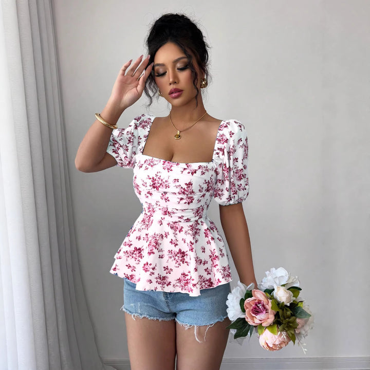 Dame Peplum-bluse med pufferm og blomstermønster Skjora