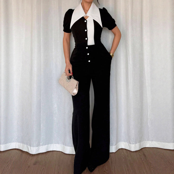 Dame jumpsuit med elegant krage og figurnær passform Skjora