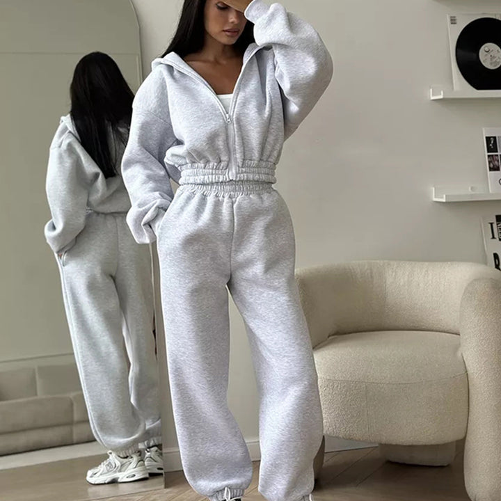 Kvinners sporty fleece jumpsuit med hette og løs passform Skjora