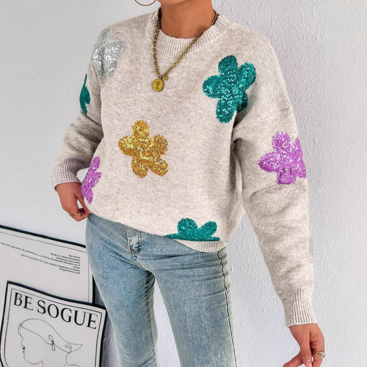 Kvinnes glitrende oversized genser med blomstermotiv Skjora