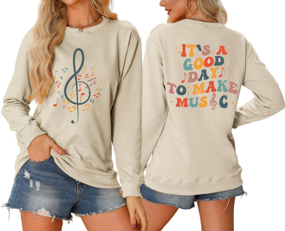 Dame sweatshirt med musikalsk motiv og kreativ skrift Skjora
