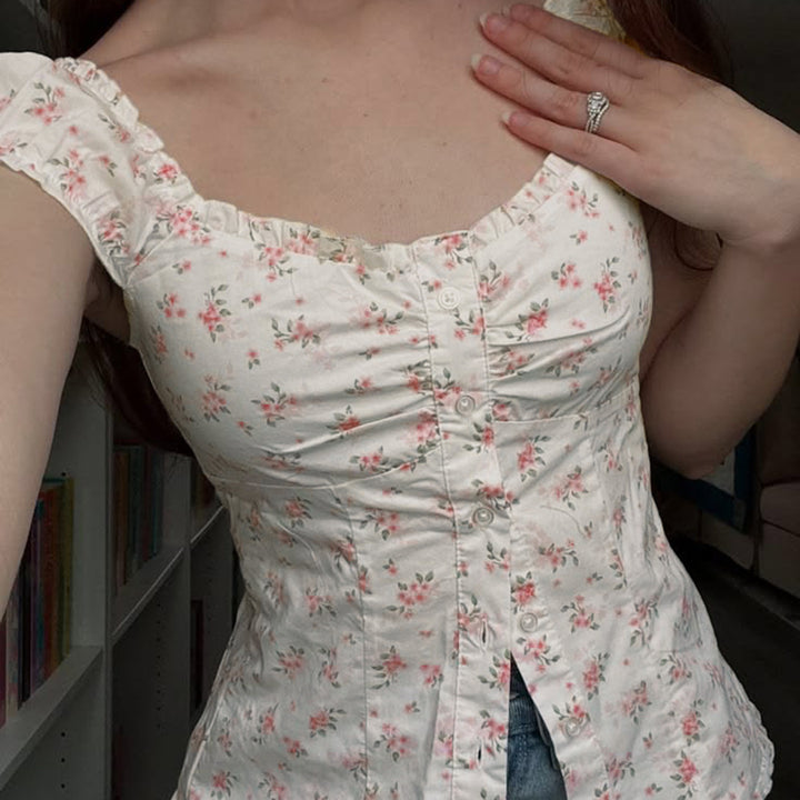 Damebluse med blomsterdesign og volangdetaljer Skjora