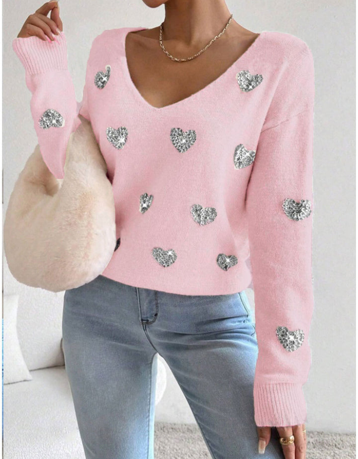 Kvinnelig oversized genser med dyp V-hals og hjerte motiver Skjora