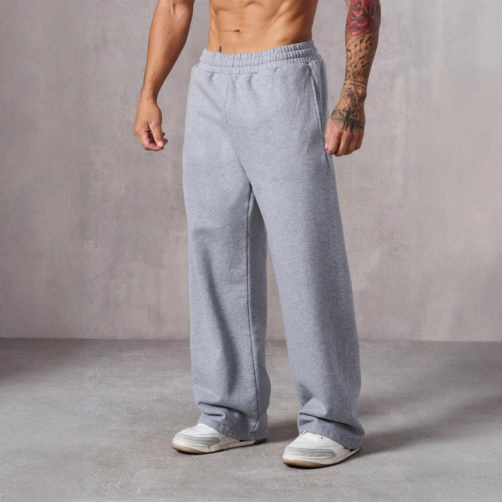 Herre Baggy Joggebukser med Elastisk Liv og Lommer på Siden Skjora