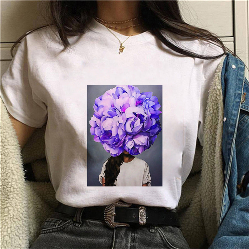 Dame T-skjorte med blomstertrykk og kreativt kunstmotiv Skjora