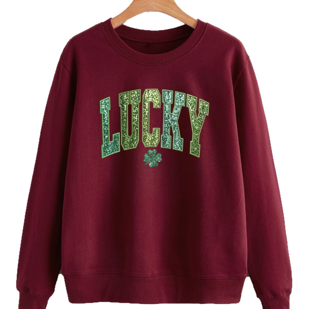 Dame uformell sweatshirt med glitrende skrift og firkløvermotiv Skjora