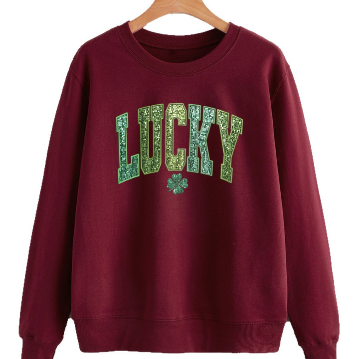 Dame uformell sweatshirt med glitrende skrift og firkløvermotiv Skjora