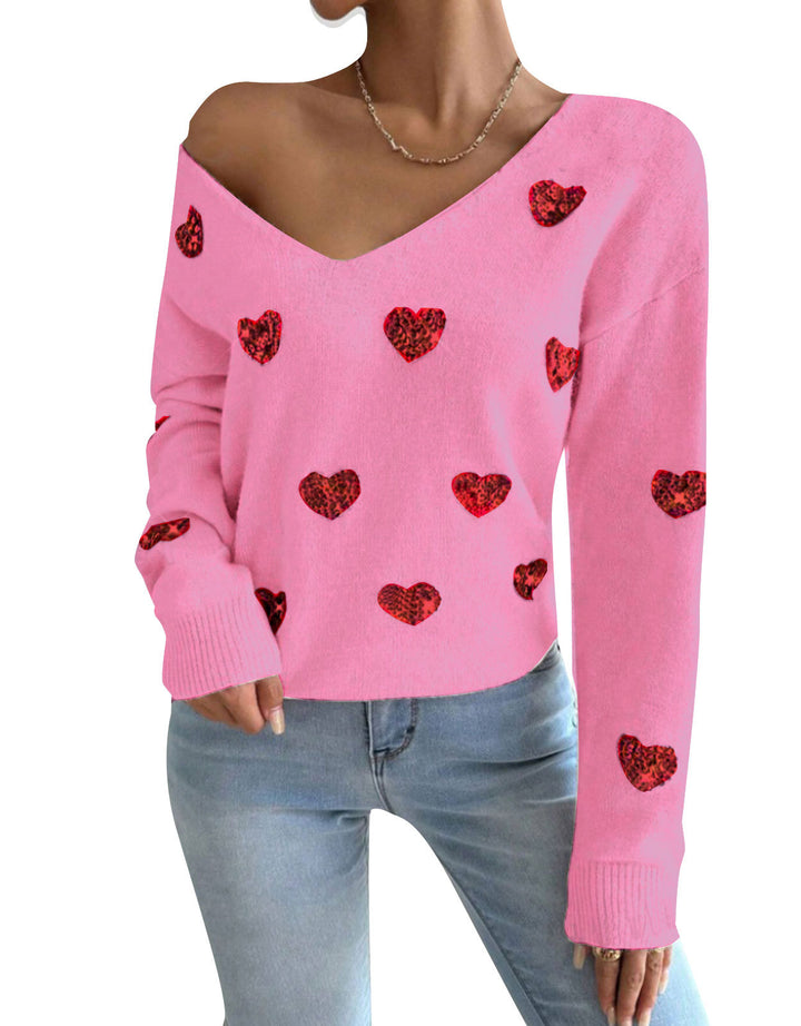 Kvinnelig oversized genser med dyp V-hals og hjerte motiver Skjora