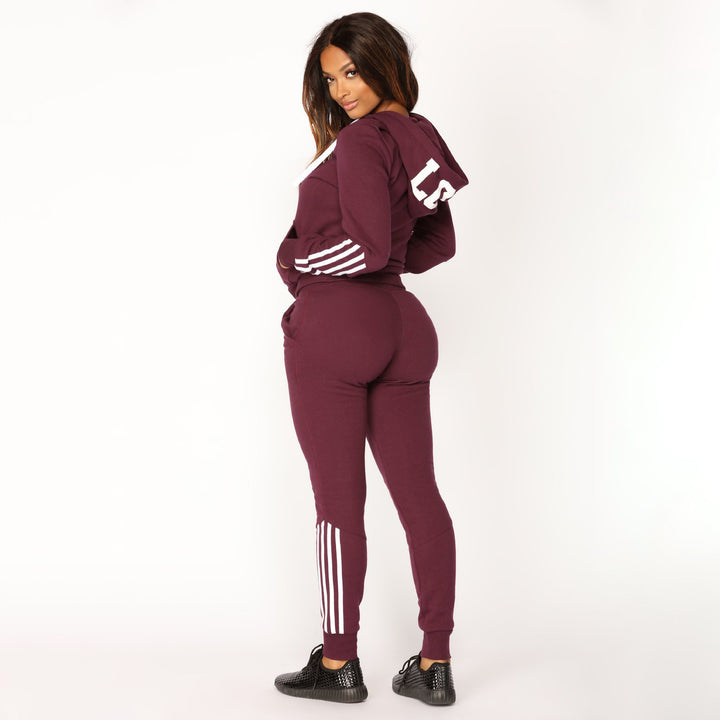Dame sporty fleece joggedress med sidestriper Skjora