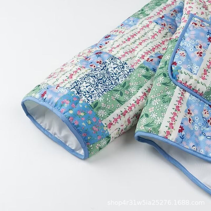 Dames Patchwork Polstret Jakke med Blomstermønster og Praktiske Sidelommer Skjora