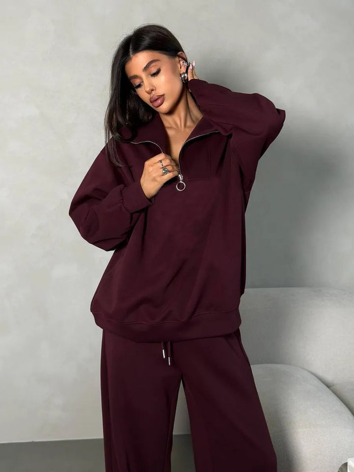 Kvinnens elegante fleece treningsoverall med høy krage og praktisk glidelås