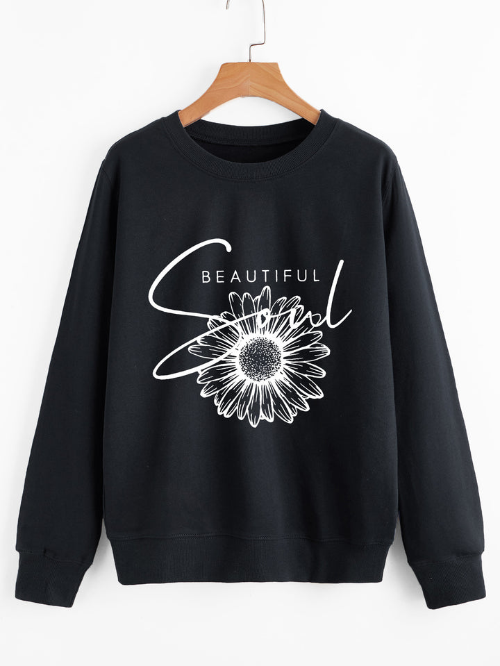 Dame genser med blomstermotiv og inspirerende tekst Skjora