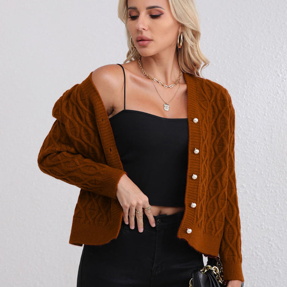 Women's designer cardigan with cable pattern and soft colors Skjora