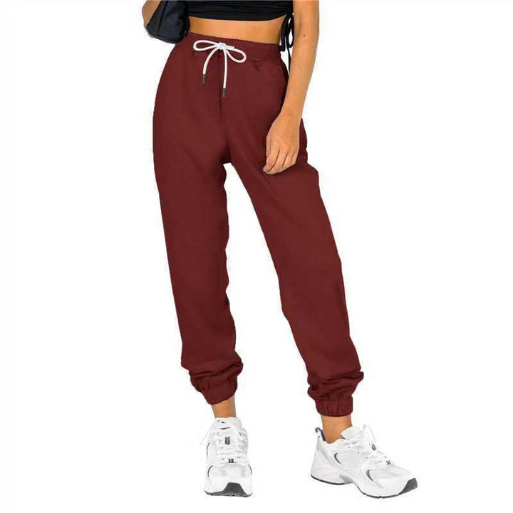 Kvinne sporty joggebukser med praktisk snor og elastisk liv.