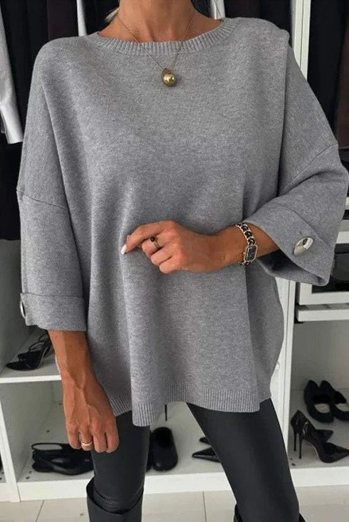 Kvinne Elegant Strikkegenser med Bred Kutt Ermer og Knappe Detaljer Skjora