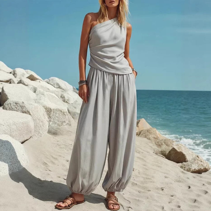 Damer Elegant Einteiler-Outfit med Flytende Snitt og One-Shoulder-Design Skjora