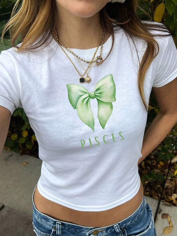Dame Crop-Shirt med sjarmerende sløyfe-motiv og astrologisk trykk Skjora