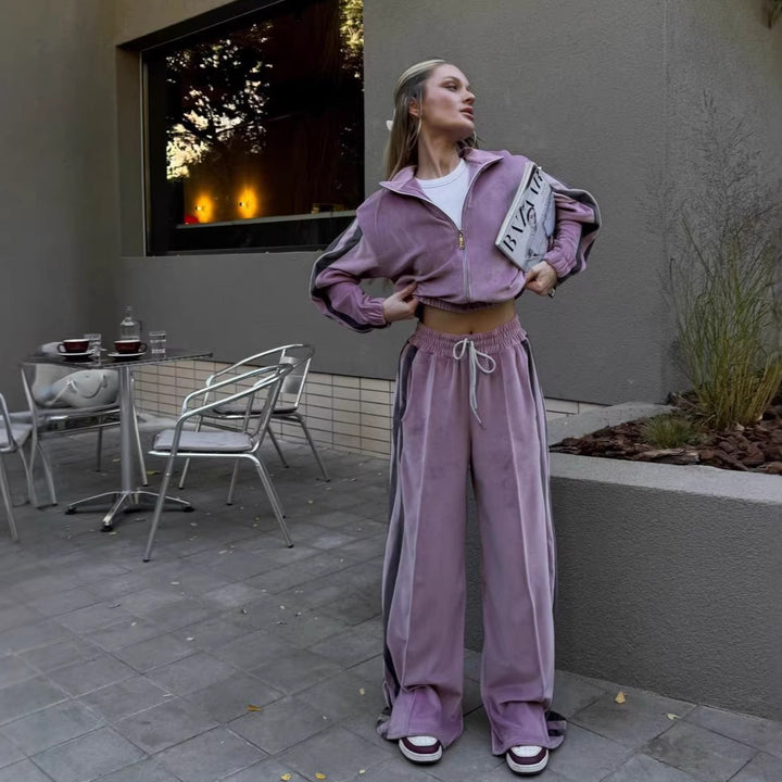 Kvinnesporty velour treningsdrakt med hevet krage og elastisk midje