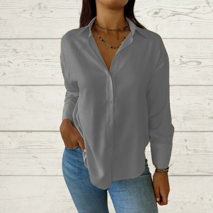 Dame elegant langermet bluse med fint stoff og feminine detaljer Skjora