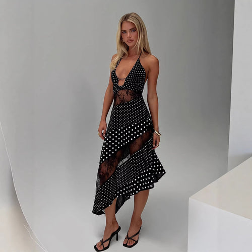 Women's halter neck dress with sheer inserts and asymmetric hem Skjora