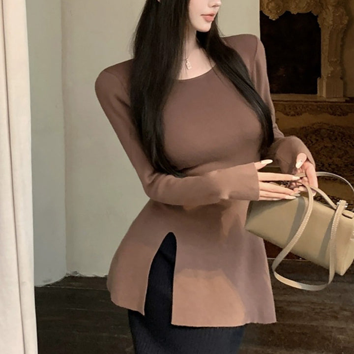 Kvinne langermet topp med asymmetrisk kutt og elegant detalj