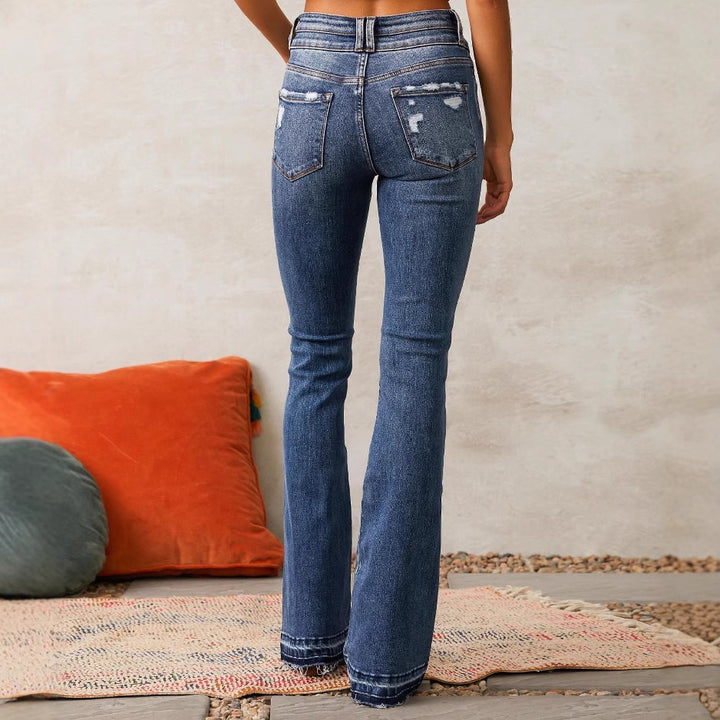 Kvinnelige flared jeans med høy midje og fashionable ødelagt effekt Skjora