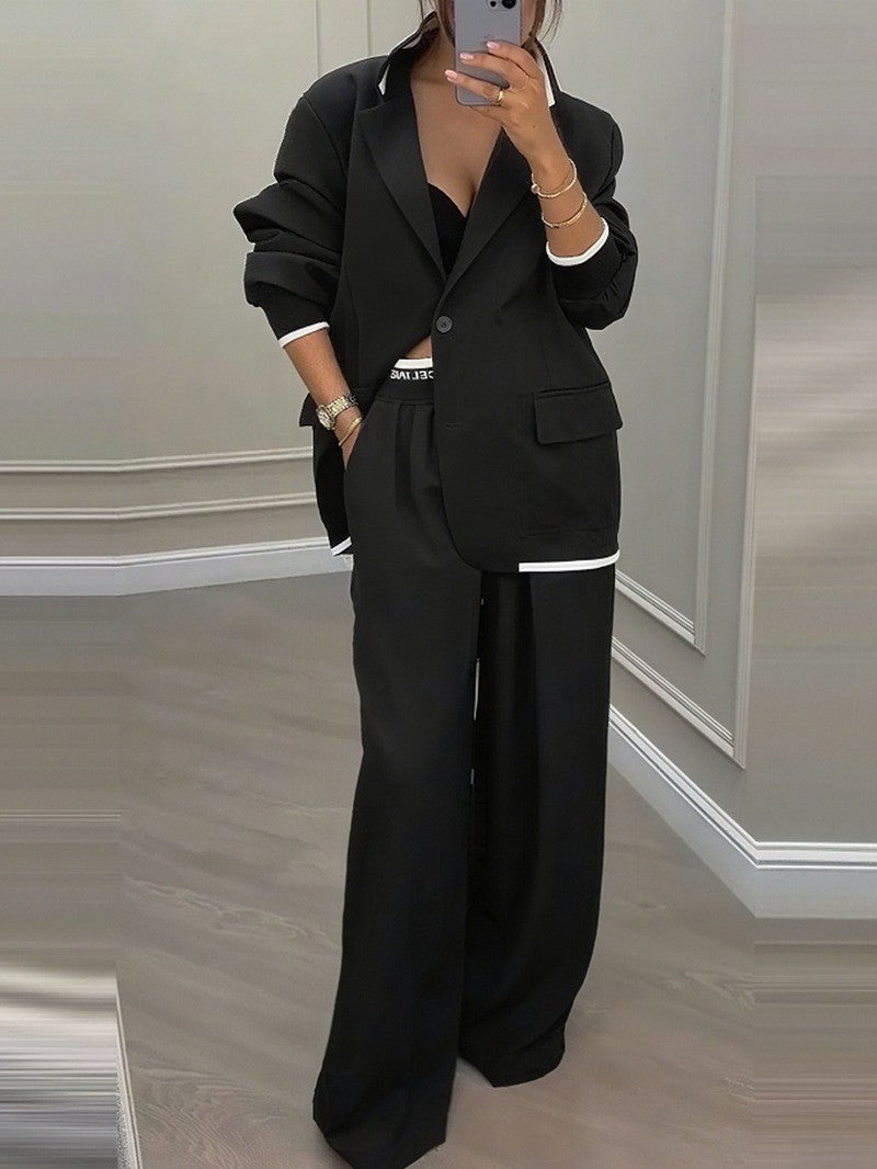 Kvinnes moderne oversized blazer sett med elegante dressbukser Skjora