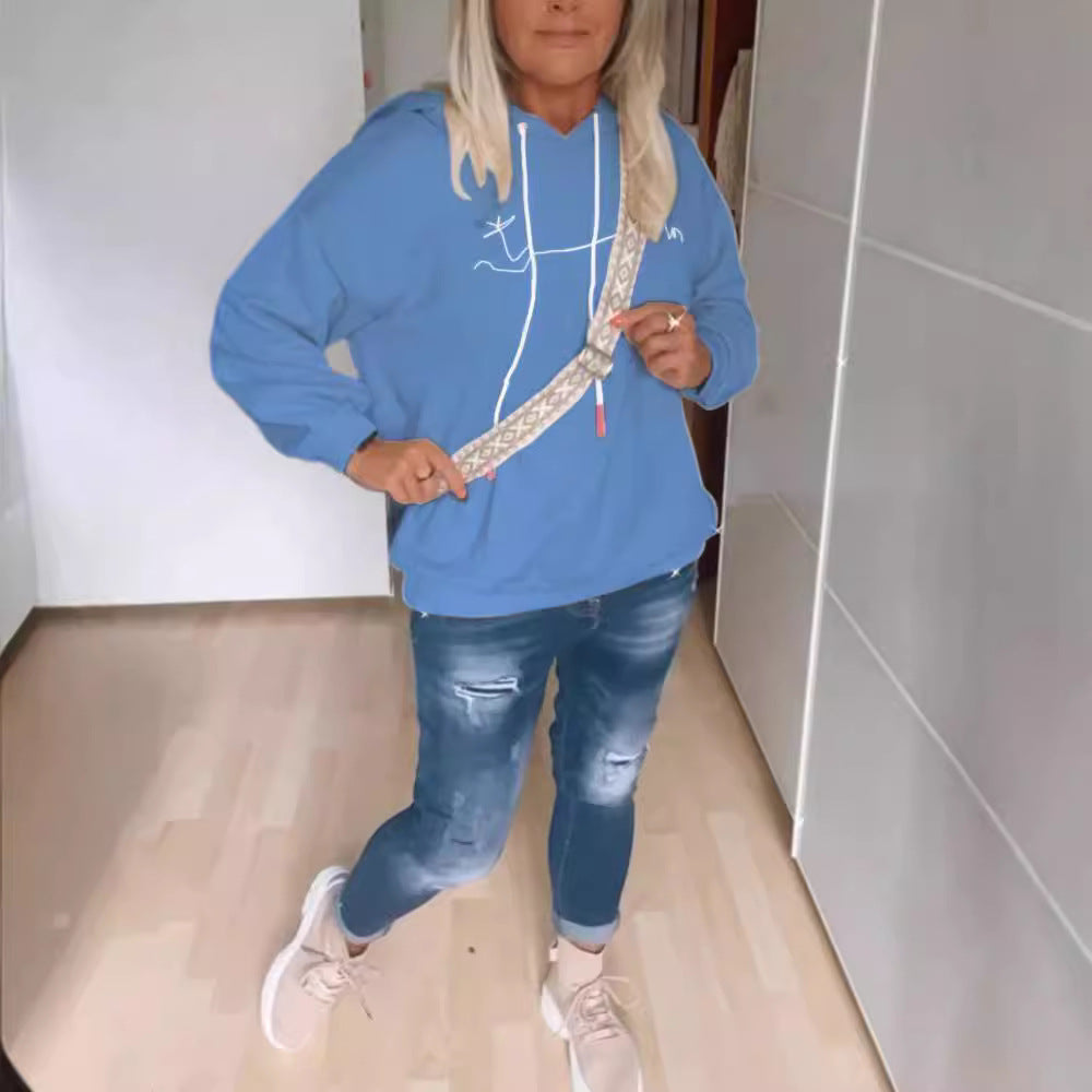 Dames avslappet hettegenser med moderne trykk og praktiske lommer Skjora