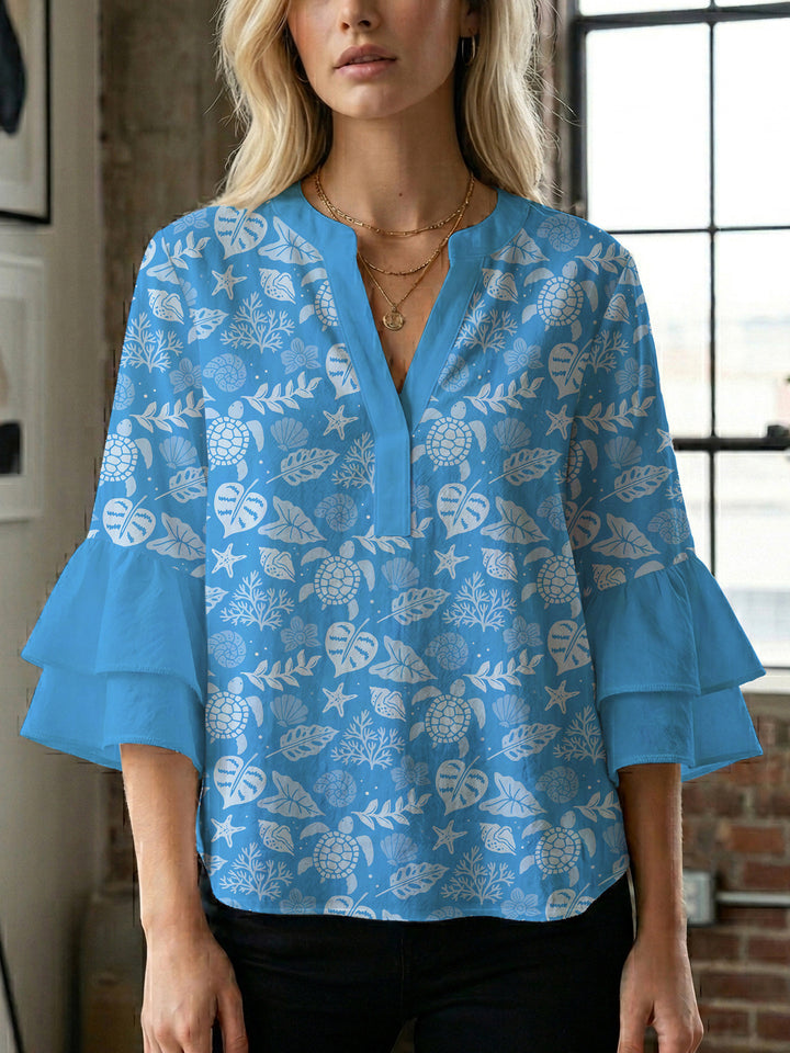 Dame bluse med voluminøse rysjermer og moderne motiv Skjora