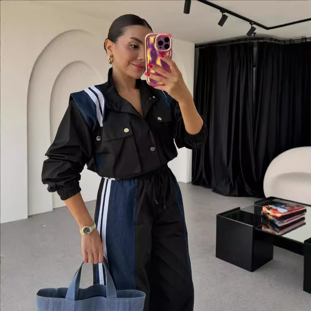 Women's sporty jumpsuit with sophisticated drawstring detail at the waist and contrasting stripes on the skirt