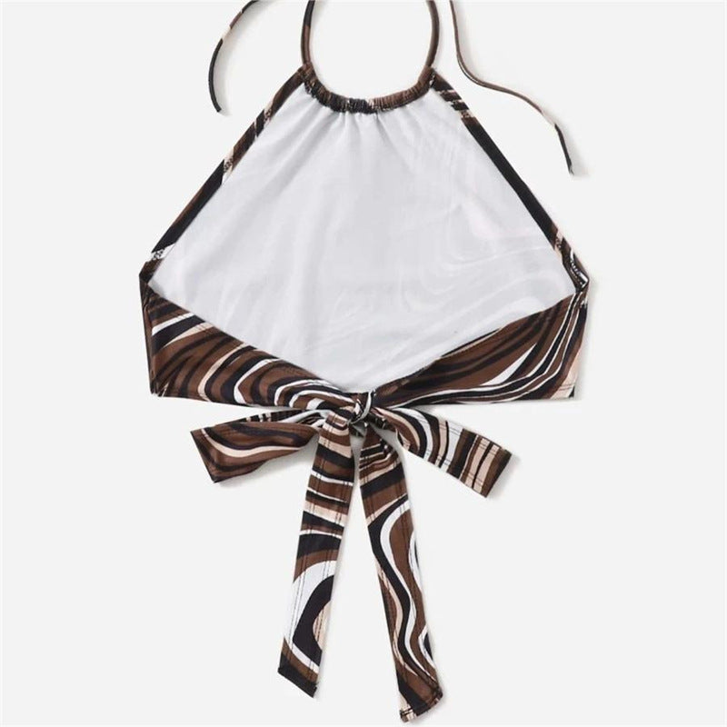 Damer trendy halterneck topp med elegant omslag-design og grafisk trykk Skjora