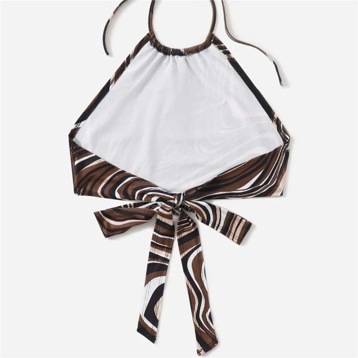 Damer trendy halterneck topp med elegant omslag-design og grafisk trykk Skjora