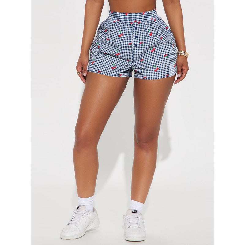 Dame Shorts med livlig rutemønster og lekete fruktprint Skjora