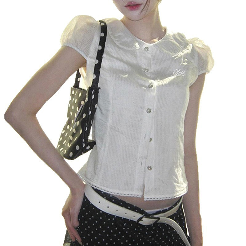 Dame elegant bluse med ståkrage og dekorative knapdetaljer Skjora