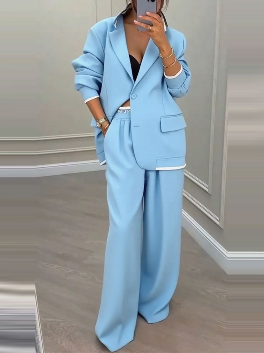 Kvinnelig elegant blazer og bukse sett med bred kutt og moderne design Skjora