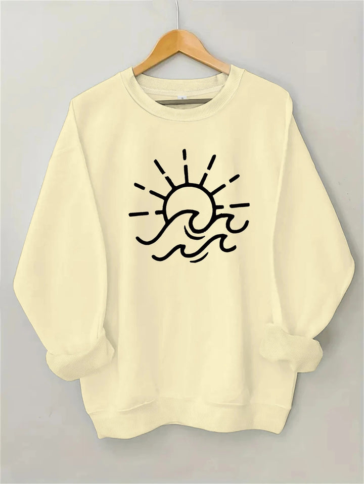 Dame sweatshirt med kreativ sol- og bølgedesign Skjora