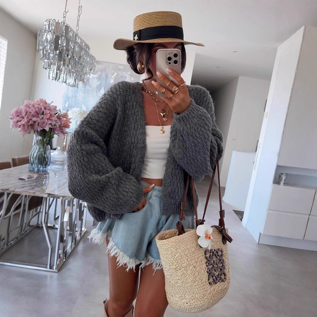 Kvinnes chunky strikk cardigan med voluminøse ermer og åpen front Skjora
