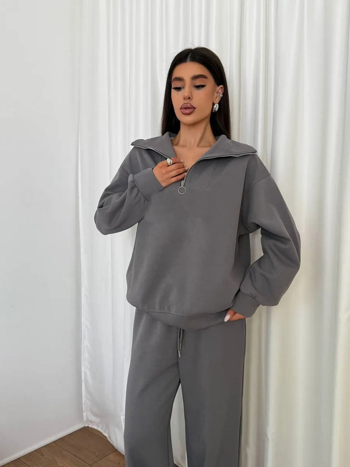 Kvinnens elegante fleece treningsoverall med høy krage og praktisk glidelås