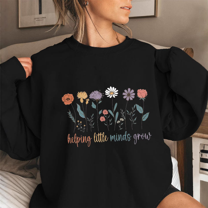 Kvinnesweatshirt med voluminøse ermer og motiverende blomstertrykk Skjora